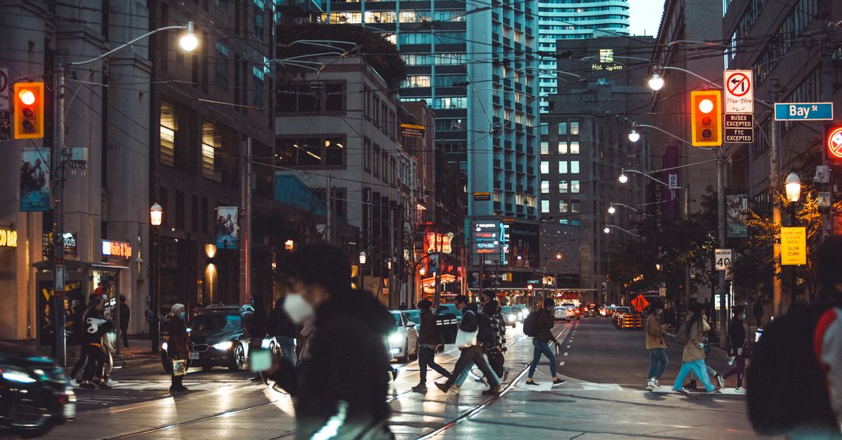 Commuters walking in downtown Toronto, illustrating Canada's weakening job market in 2025
