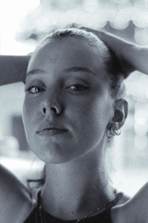 Free Black and white portrait of a young woman with serene expression. Stock Photo