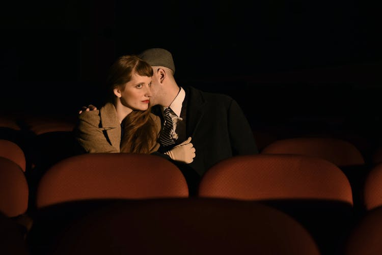 Close-up Photo Of Couple In A Theatre