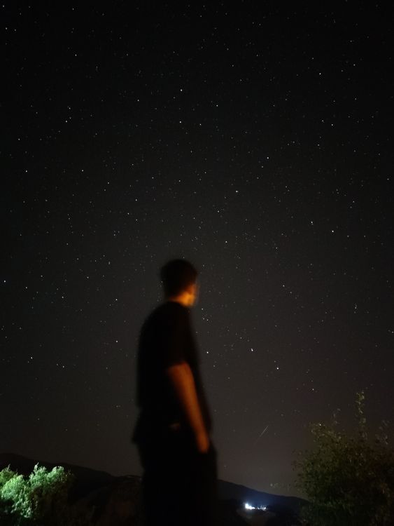 Man standing under a Starry Sky · Free Stock Photo