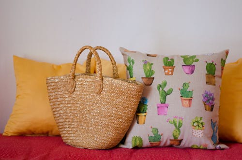 Free Brown Rattan Handbag on Sofa Stock Photo