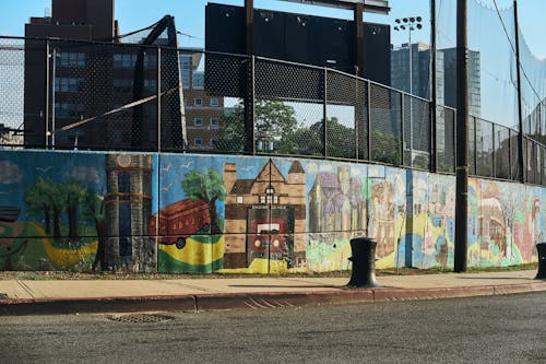 A Wall with Graffiti by the Road