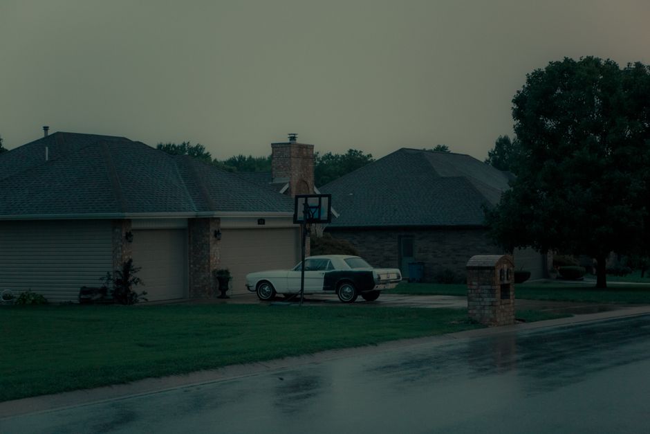 quiet suburban neighborhood morning after confrontation