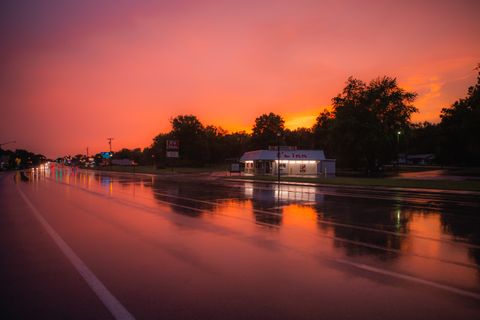 Sunset reflections on a wet road — photo by Yura Forrat on Pexels