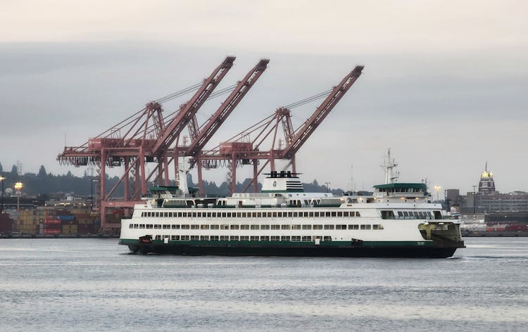 White Ship Near Port With Cranes 