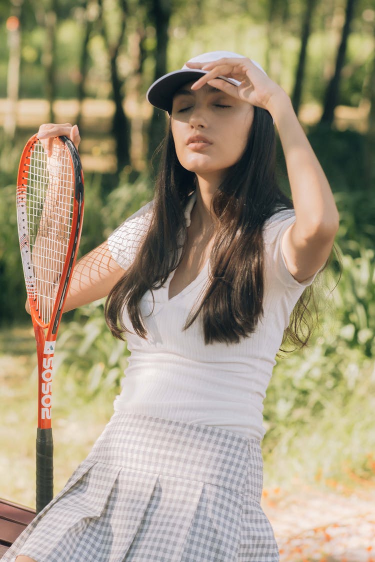 A Woman With A Tennis Racket 