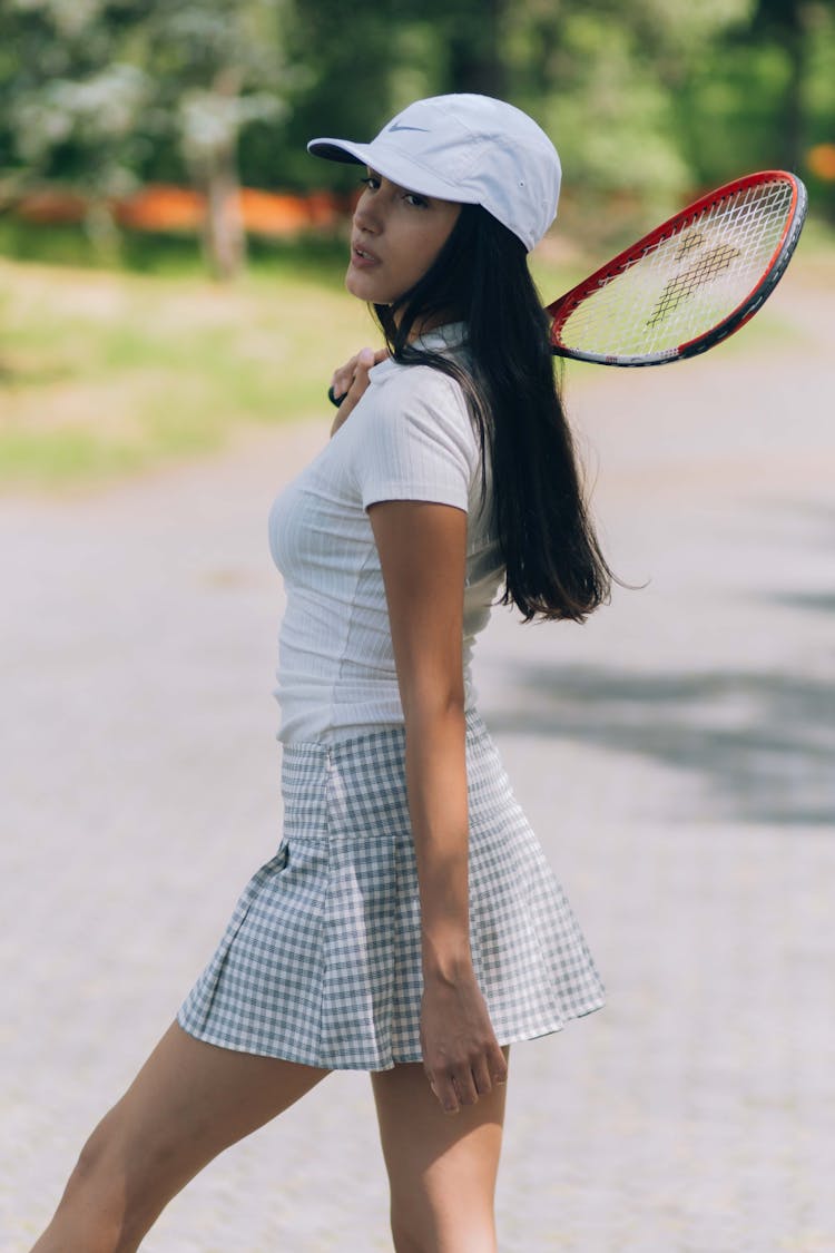 A Tennis Player Holding A Racket 