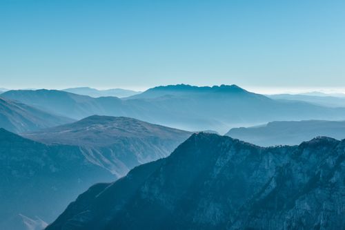 Free A breathtaking view of mountain ranges under a clear blue sky in Bosnia and Herzegovina. Stock Photo