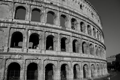 Free A stunning monochrome view of the historic Colosseum in Rome, Italy, capturing its architectural grandeur. Stock Photo