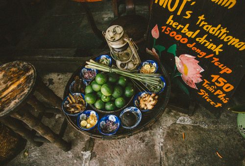 Free An overhead view of traditional herbal drink ingredients displayed on a street table, capturing vibrant textures and colors. Stock Photo