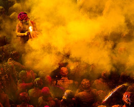 People celebrating Holi in Barsana, India with bright colors and joy.
