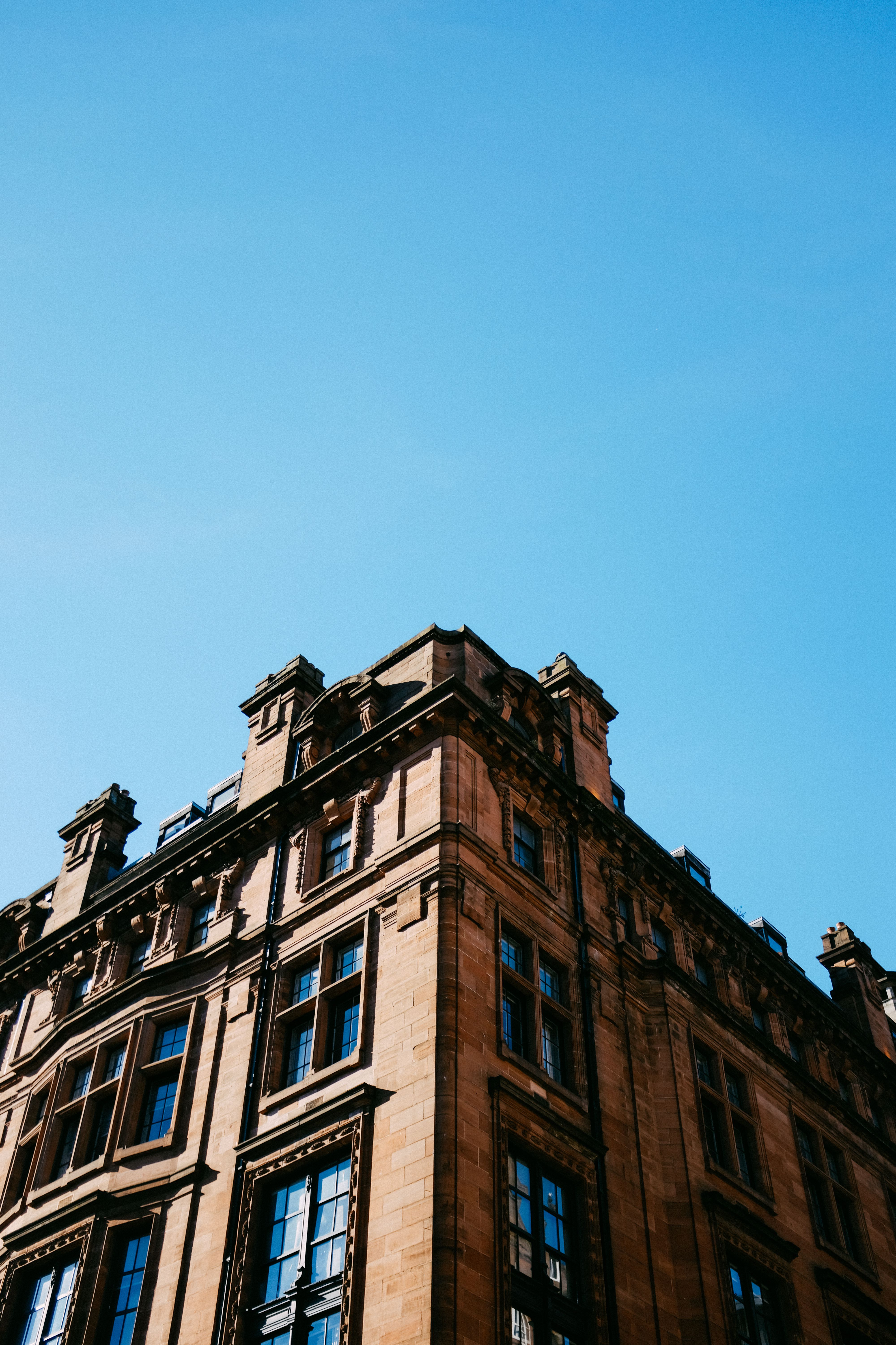 Brown Concrete Building Under Blue Sky · Free Stock Photo
