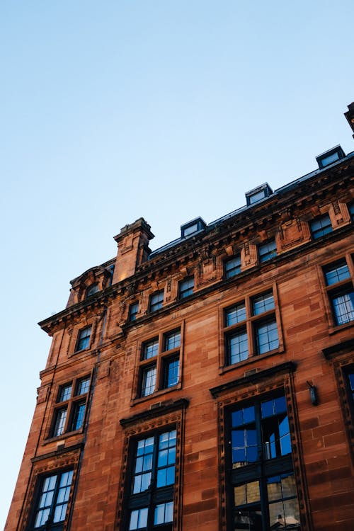 Low Angle Shot of a Brown Brick Building