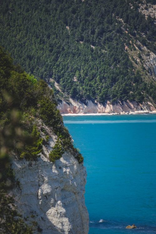 Free Breathtaking view of coastal cliffs against a vibrant turquoise sea, perfect for travel destinations. Stock Photo