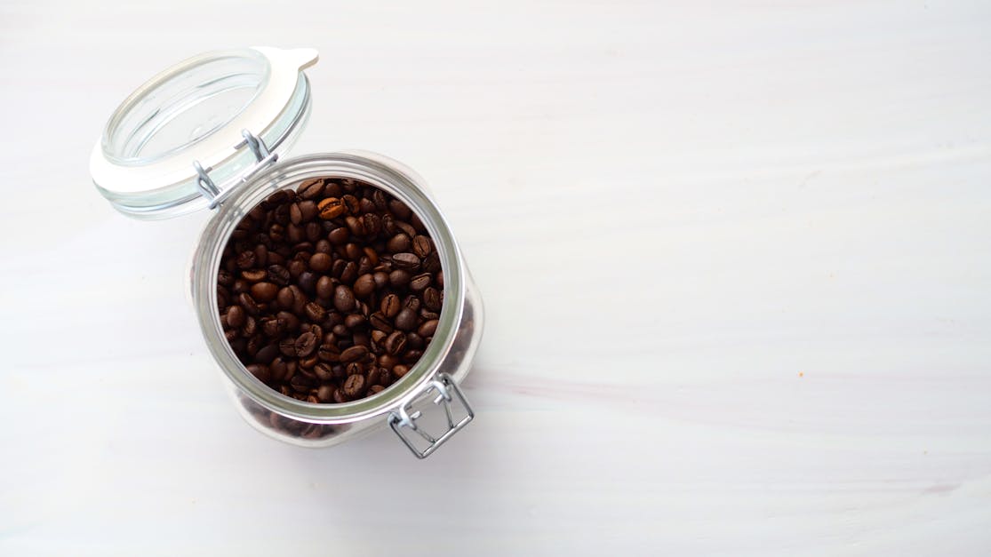 Coffee Beans In A Glass Canister Stock Photo - Download Image Now
