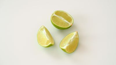 Fresh lime slices on white background