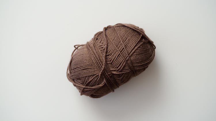 Brown Yarn On White Background 