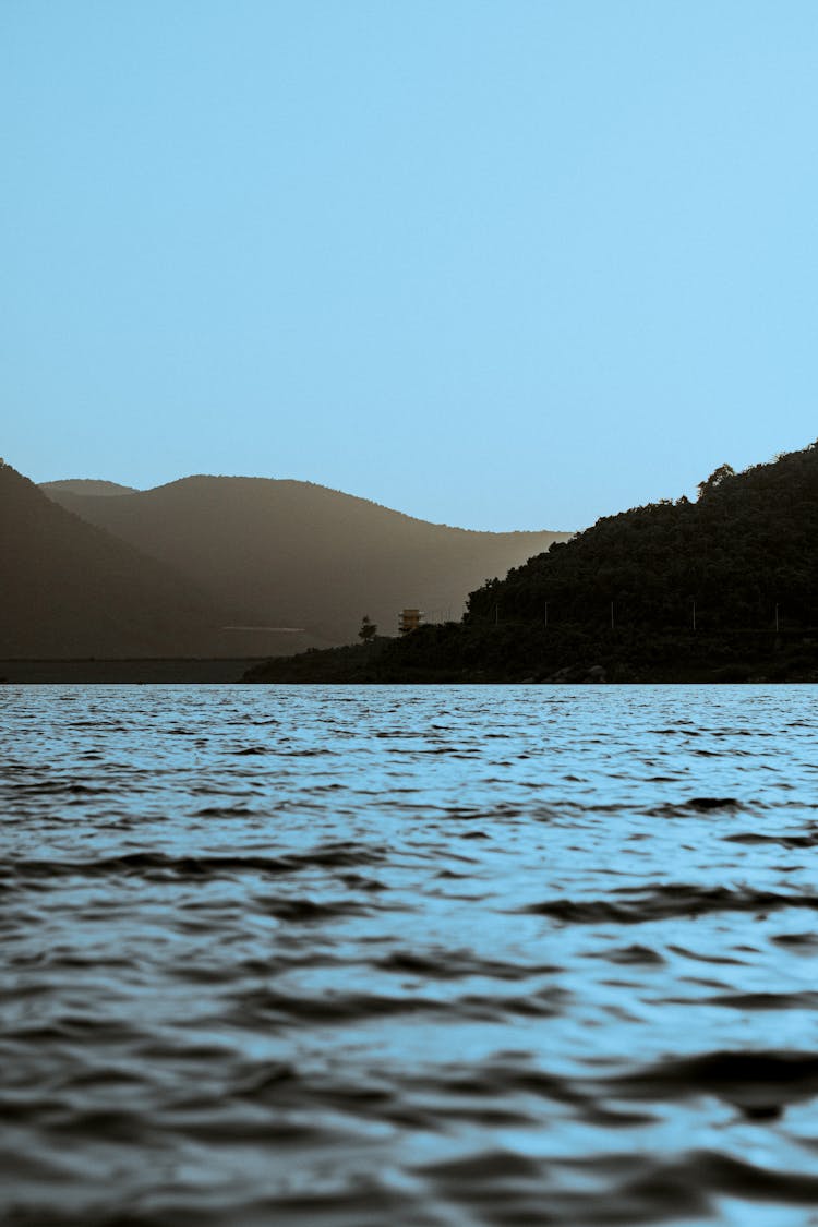 Body Of Water Near Mountains