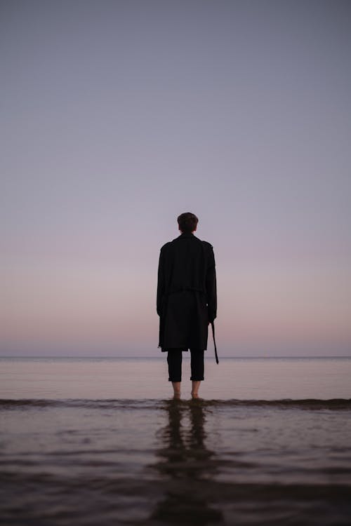 Back View of Man on Sea Shore