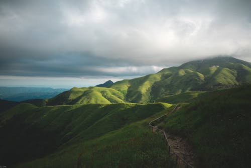 Beautiful Green Mountains Under Cloudy Sky