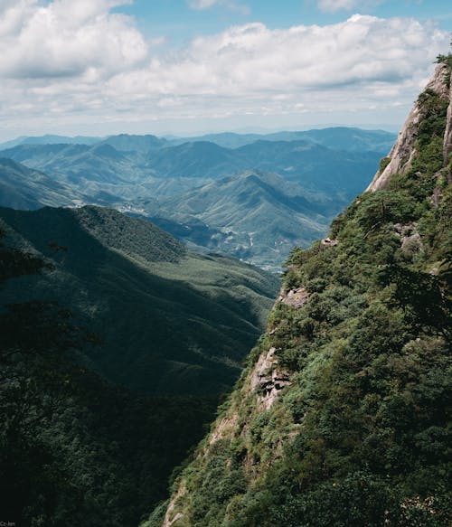 Mountain Range Under Cloudy Sky