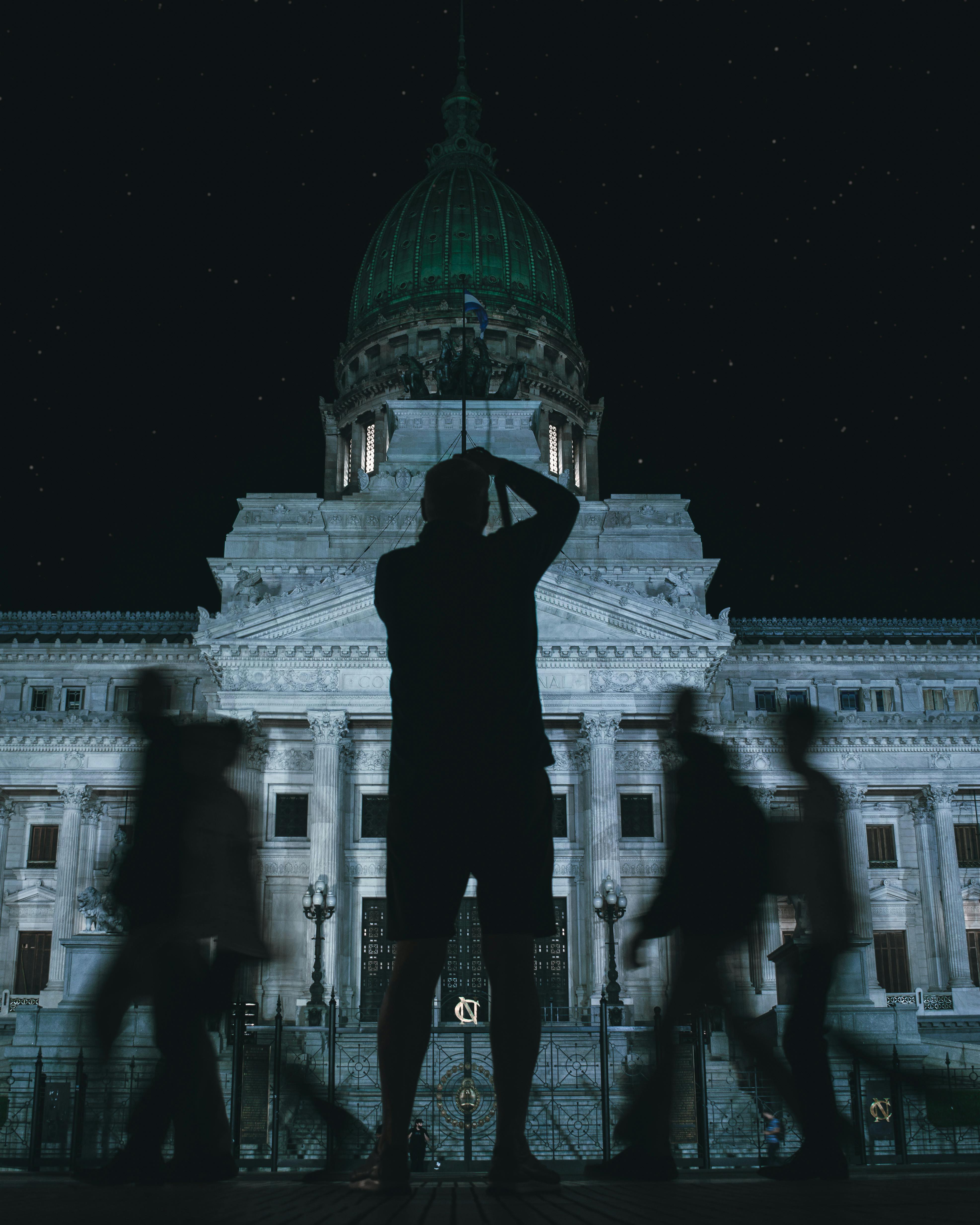 Taking Picture of Building at Night · Free Stock Photo