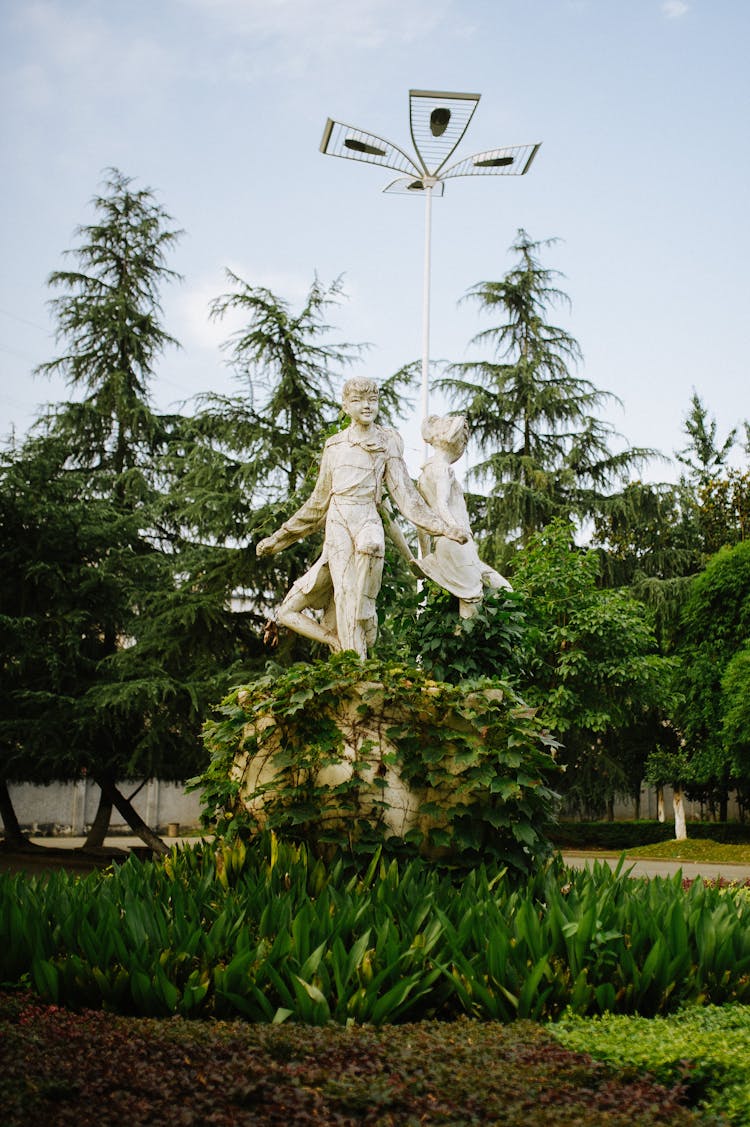 Statues Of Young Pioneers In A Park