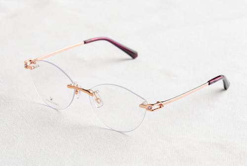 Frameless Eyeglasses on White Surface