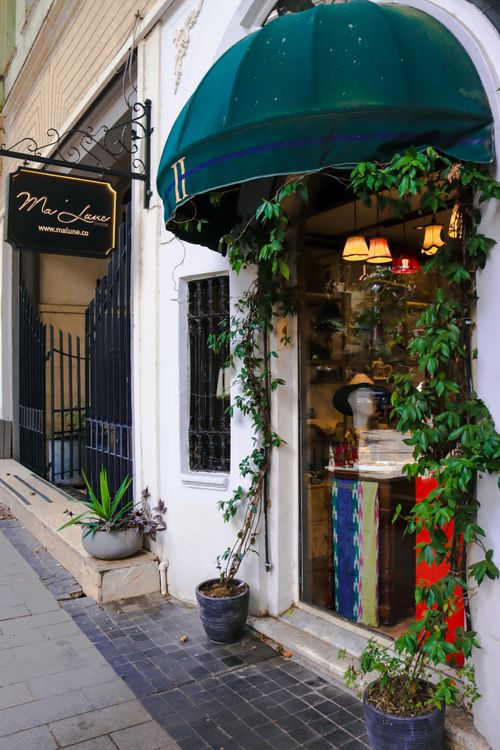 Free Cozy shop entrance adorned with plants and colorful decor. Stock Photo
