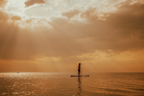 Woman Standing on a Paddleboard