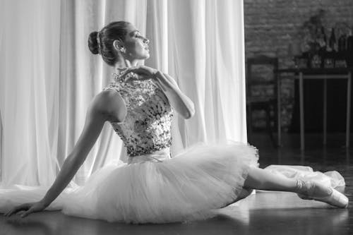 Grayscale Photo of Woman in a Tutu Skirt