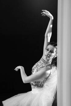 Graceful ballerina posing in monochrome, showcasing a classic dance pose.