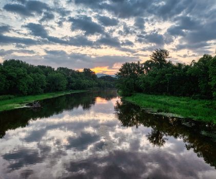 Green Trees Beside River Under Cloudy Sky