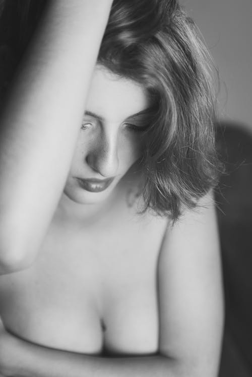 Grayscale Photo of Topless Woman 