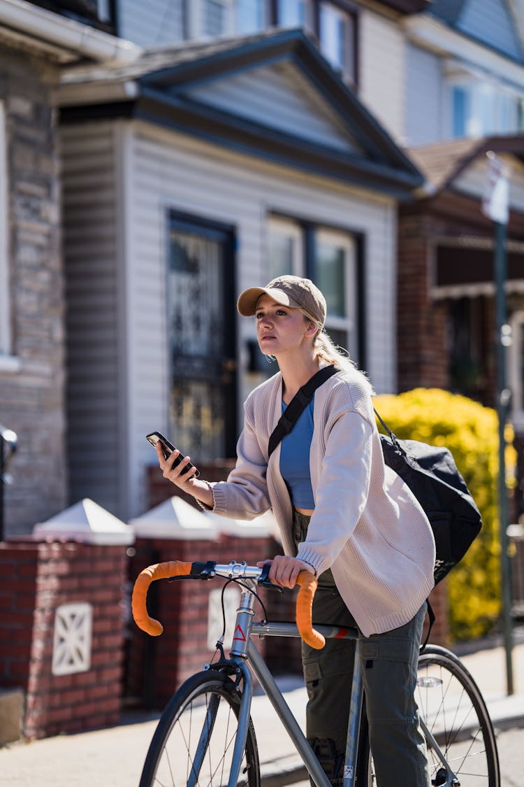 Blonde Woman On Bike With Phone