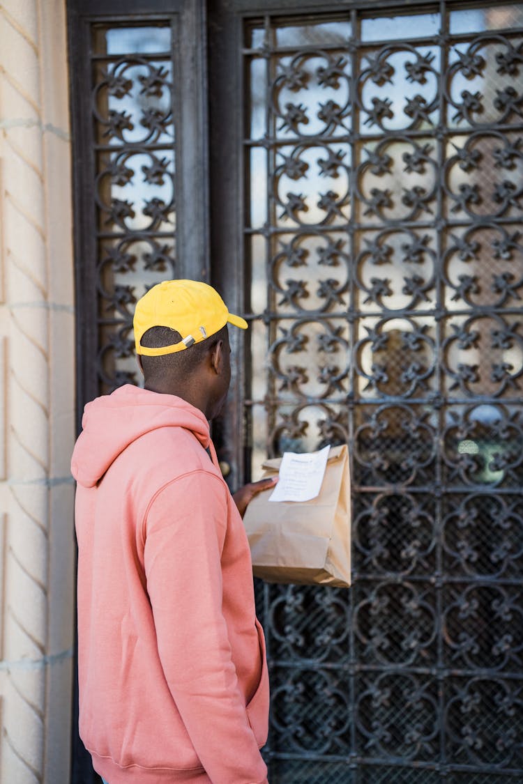 Man With Bag In Front Of Door