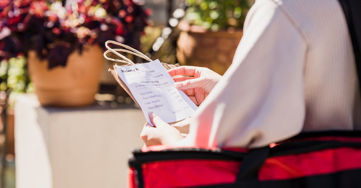 Checking The Order Food Delivery Girl Checking Address of Order Recipient · Free Stock Photo