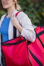 Close-up of a Woman Carrying a Food Delivery Bag