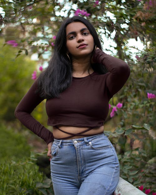 Woman in Black Crop Top and Denim Pants · Free Stock Photo