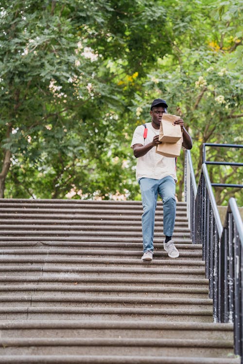 Deliveryman with Order Running Stairs