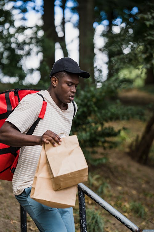 Courier with Packages Delivering Order