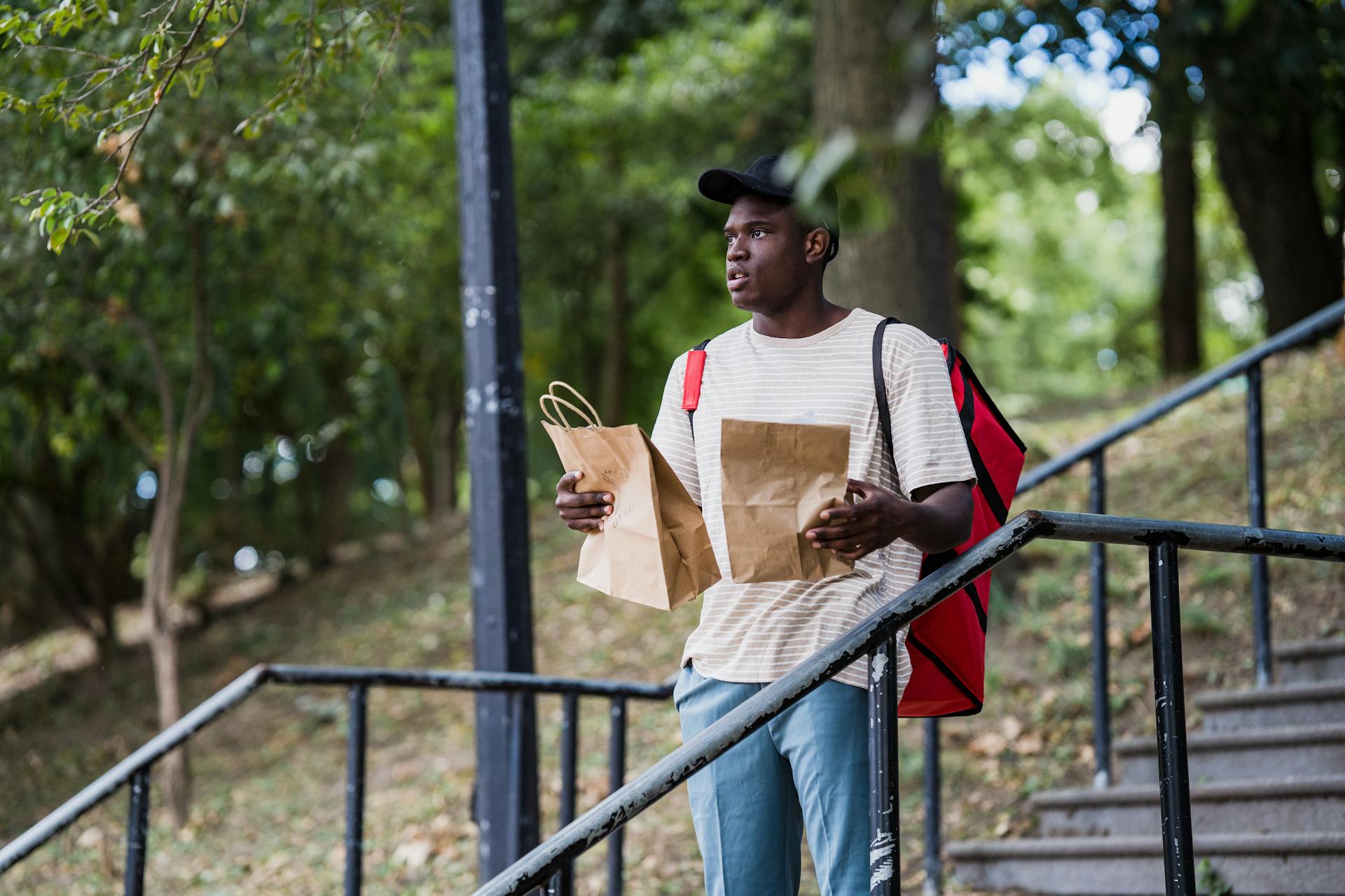 Courier with Packages on Stairs