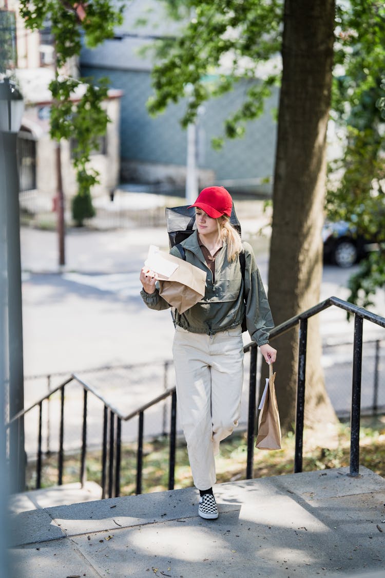 Delivery Woman Carrying Paper Bags