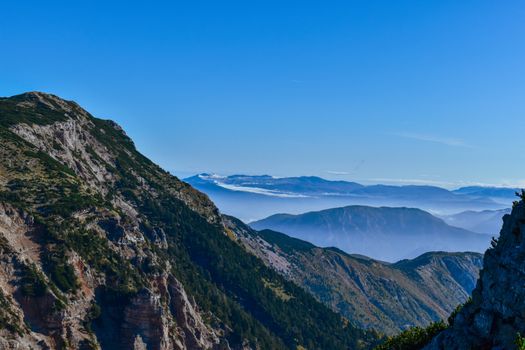 Panoramic view of mountains in Bosnia and Herzegovina under a clear blue sky.