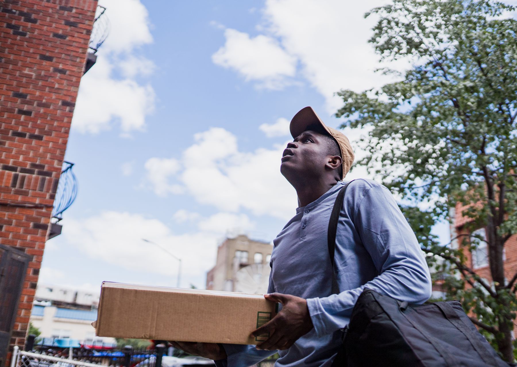 House removals in Sutton — crew wrapping and loading on moving day