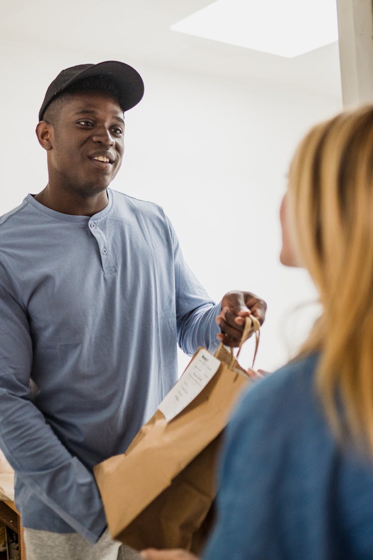 Man Delivering Food To Woman