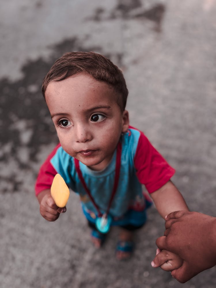 Toddler Holding An Ice Cream