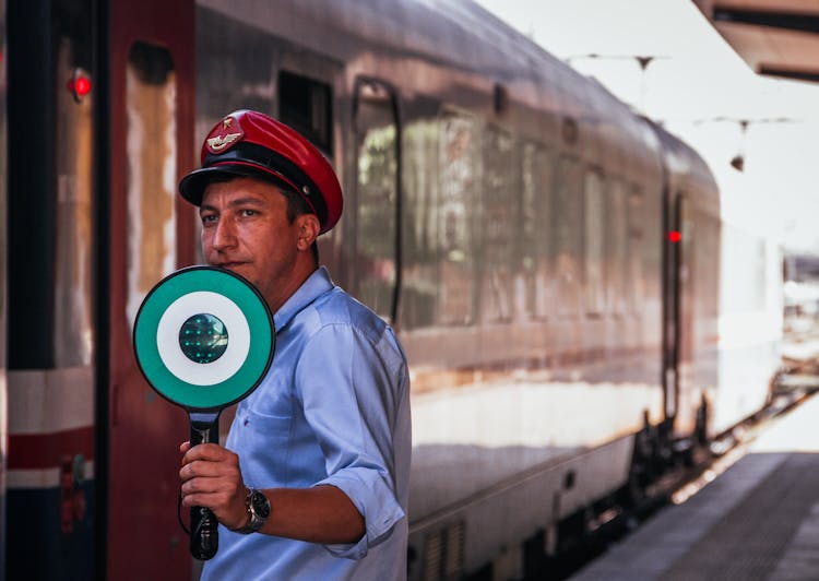 Conductor Near Train