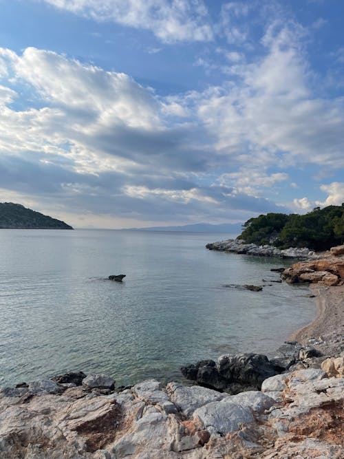 A Rocky Shore under a Cloudy Sky