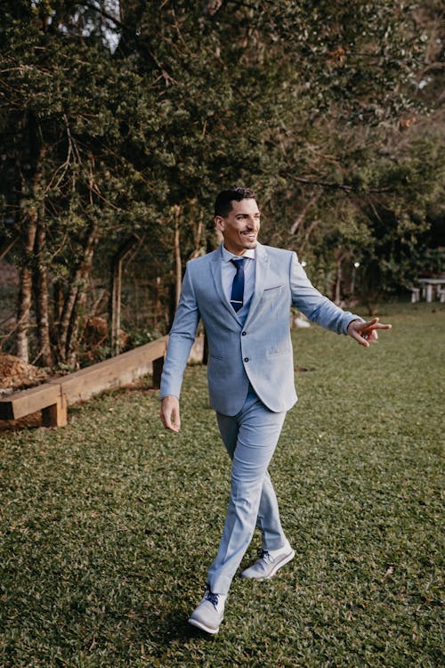 A Man in a Suit Walking 